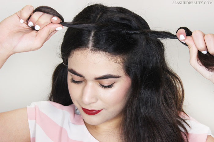 This half-up dutch braid tutorial is perfect for the warmer weather while keeping hair flowing in the breeze. See the step-by-step tutorial! | Slashed Beauty