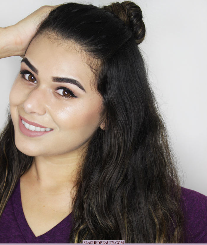 Textured hair looks great when recreating this topknot tutorial! See the step by steps and check out how to get the look with drugstore styling products. | Slashed Beauty
