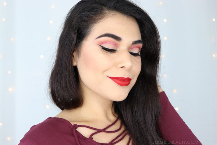 This easy Valentine's Day Makeup features a red glitter cut crease that uses a short-cut for the on-trend look. Watch the makeup tutorial video! | Slashed Beauty