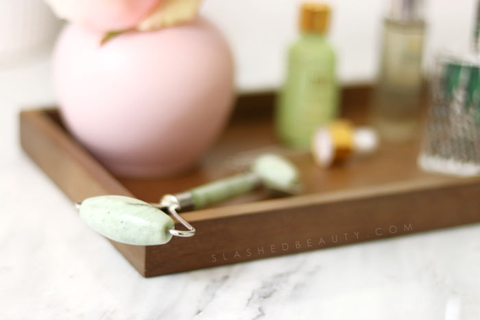 Curious about what the jade face roller trend is all about? Find out what face rollers do to your skin and if you should incorporate lymphatic massage into your routine! | Slashed Beauty