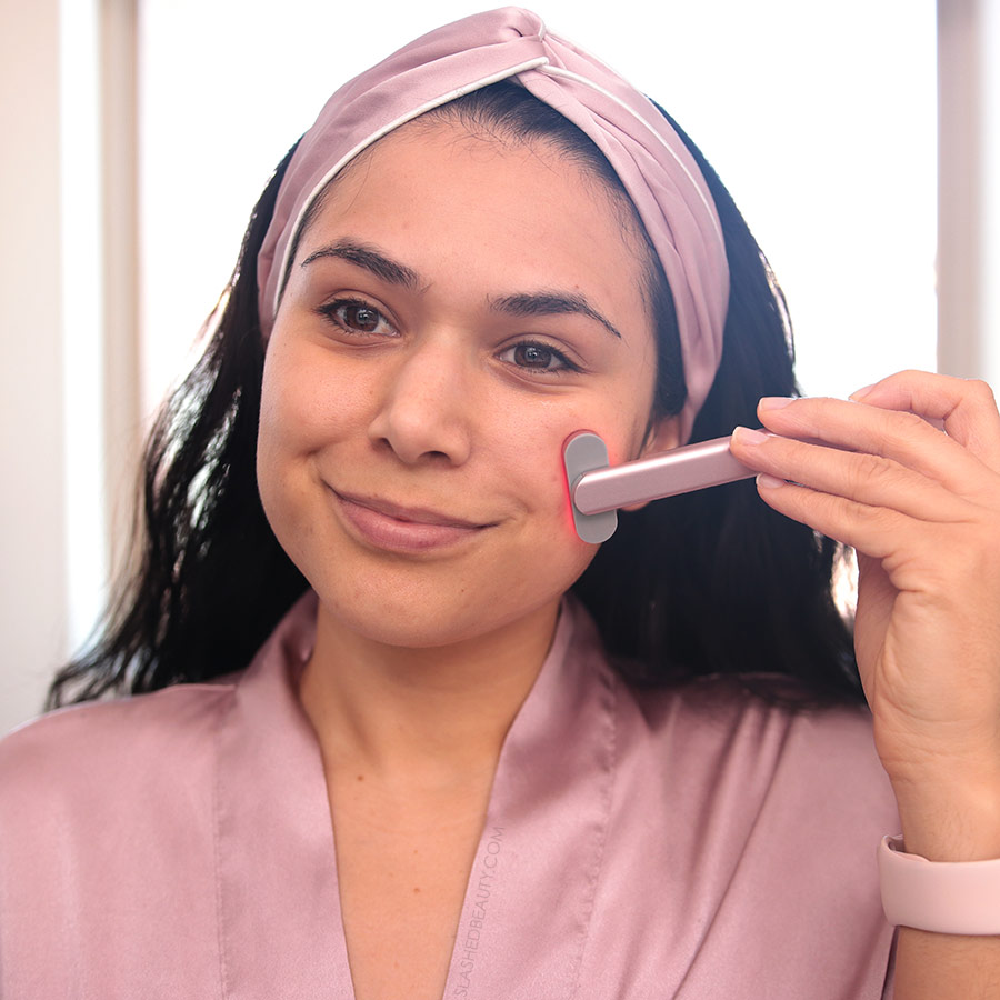 Miranda holding the SolaWave Skin Care Wand to her face | SolaWave Skin Care Wand Review, Before & After Results | Slashed Beauty