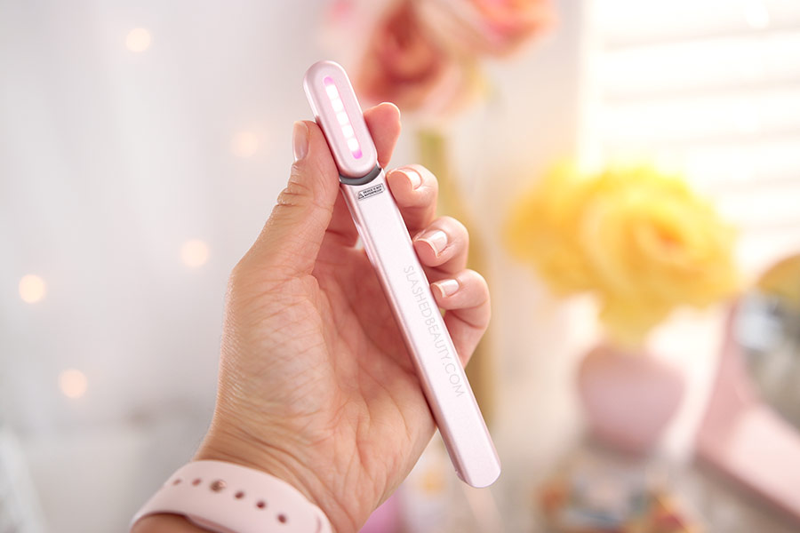 Holding the SolaWave Skin Care Wand | SolaWave Skin Care Wand Review, Before & After Results | Slashed Beauty