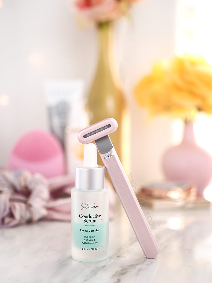 SolaWave Skin Care Wand resting on a bottle of SolaWave Renew Complex Serum | SolaWave Skin Care Wand Review, Before & After Results | Slashed Beauty
