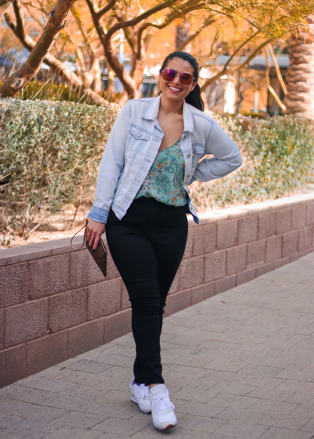 Denim jacket outfit for fall: colorful top, black jeans, white sneakers. | Create More Outfits with 3 Outerwear Essentials | Slashed Beauty