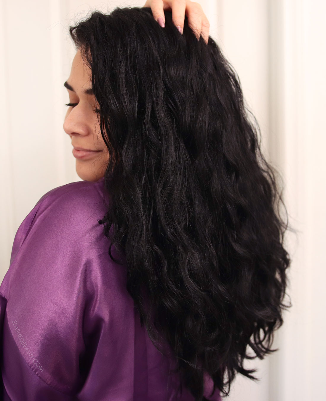 Miranda looking over her shoulder showing off thick, defined curly hair | Function of Beauty Customized Hair Care Review: Is it worth i? | Slashed Beauty