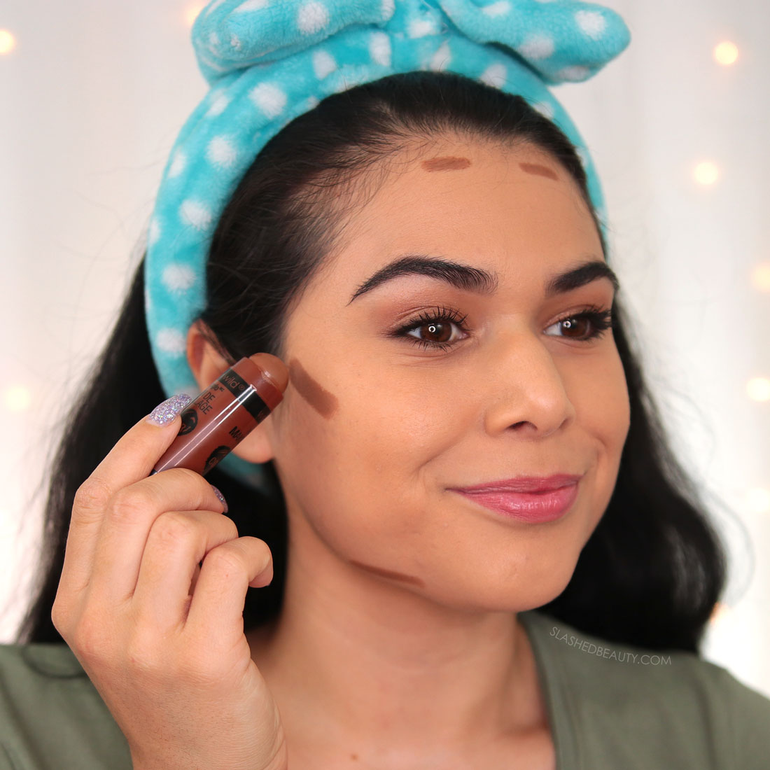 Miranda applying short strokes of the wet n wild MegaGlo Contour Stick to the cheeks, forehead and jawline | How to Use a Contour Stick: 5 Tips & Mistakes to Avoid | Slashed Beauty