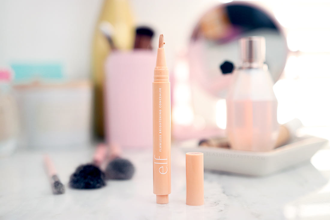 e.l.f. Flawless Brightening Concealer Pen sitting open on a marble surface | The Best Drugstore Concealers Under  in 2022 | Slashed Beauty