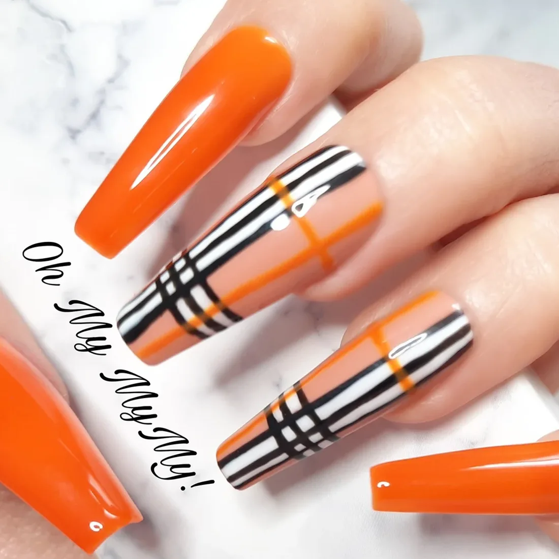 Long orange and plaid nails for fall | Trendy Fall Nail Designs You Can Buy as Press-Ons on Etsy | Slashed Beauty