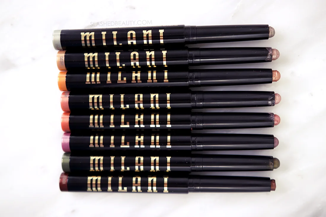 Milani Gilded Eyeshadow Sticks lying on a marble surface | The Best Drugstore Cream Eyeshadow Sticks | Slashed Beauty