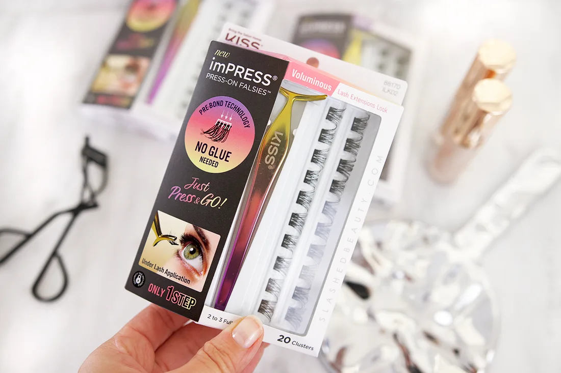 Hand holding the Kiss imPRESS Press-On Falsies Starter Kit | No Glue Press On False Lashes Review | Slashed Beauty