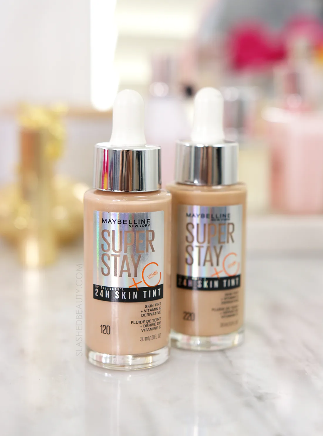 Two bottles of Maybelline SuperStay 24H Skin Tint + Vitamin C sitting on a marble vanity | Maybelline SuperStay 24H Skin Tint Review | Slashed Beauty