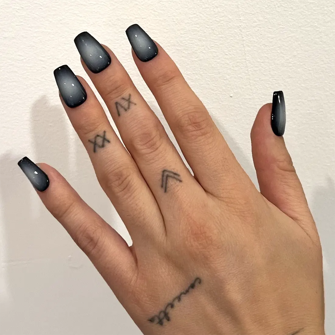 Closeup of short square black and white gradient press-on nails | 9 Witchy Nail Designs You Can Buy as Press-Ons on Etsy | Slashed Beauty