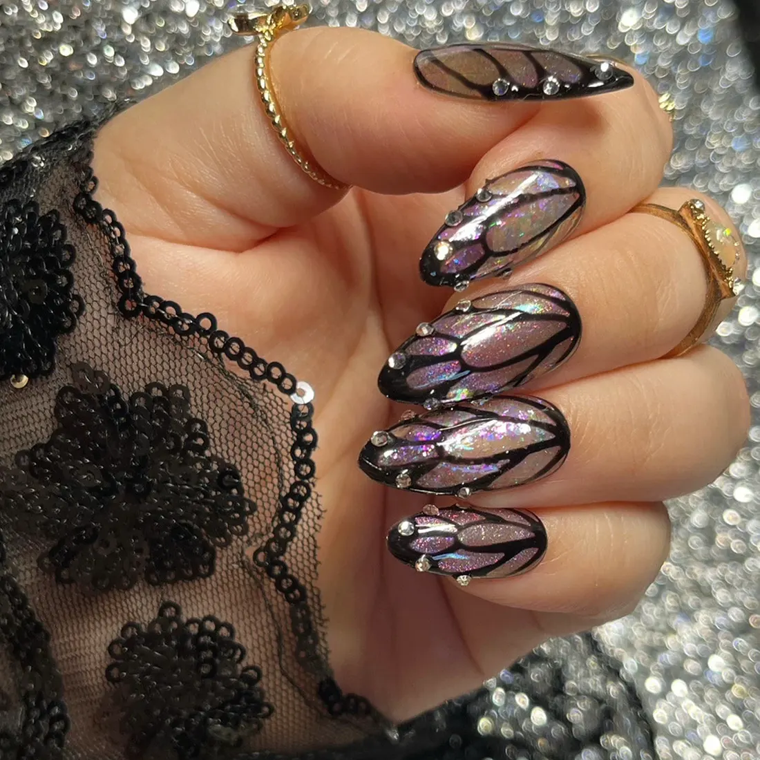 Fairy wing manicure with iridescent glitter polish and nail jewels | 9 Witchy Nail Designs You Can Buy as Press-Ons on Etsy | Slashed Beauty