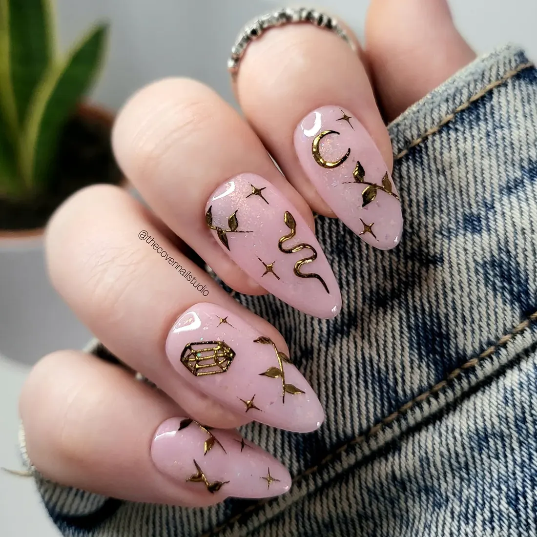 Pink opal nails with gold star and leaf nail art | 9 Witchy Nail Designs You Can Buy as Press-Ons on Etsy | Slashed Beauty