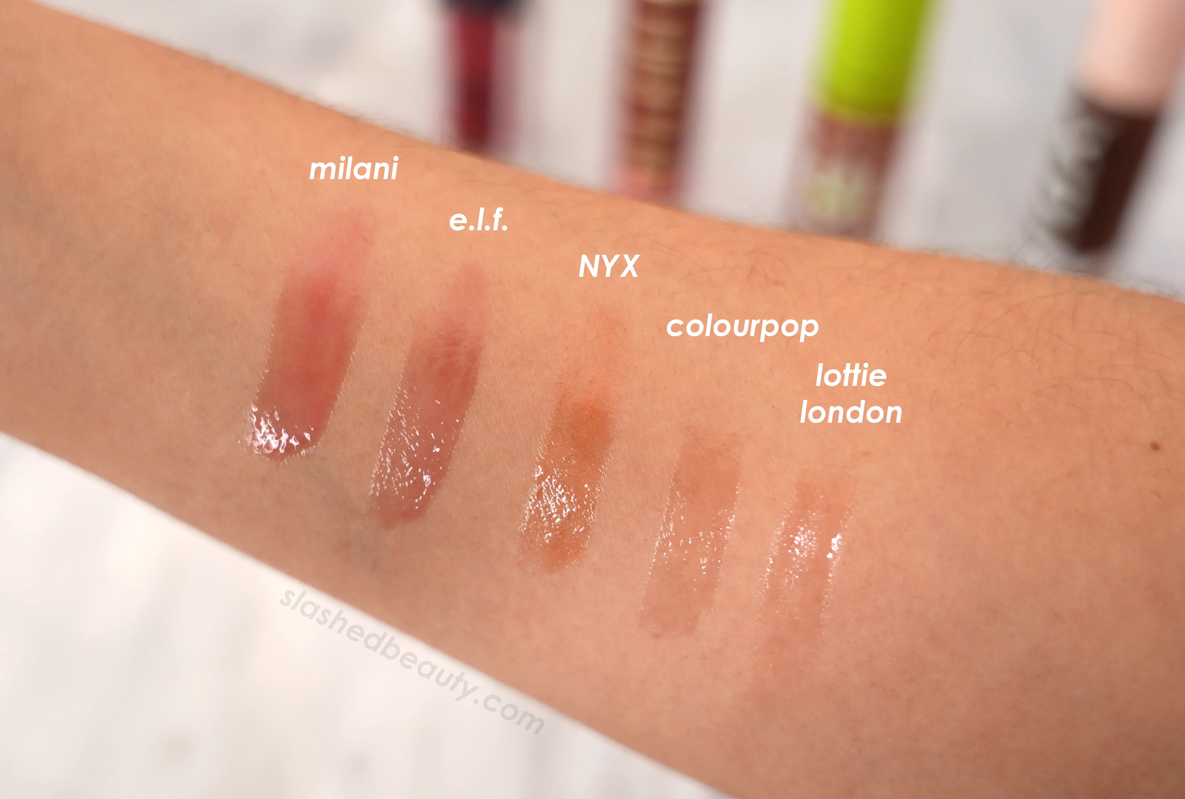 Drugstore lip oil swatches | The 5 Best Drugstore Lip Oils Tested & Compared | Slashed Beauty