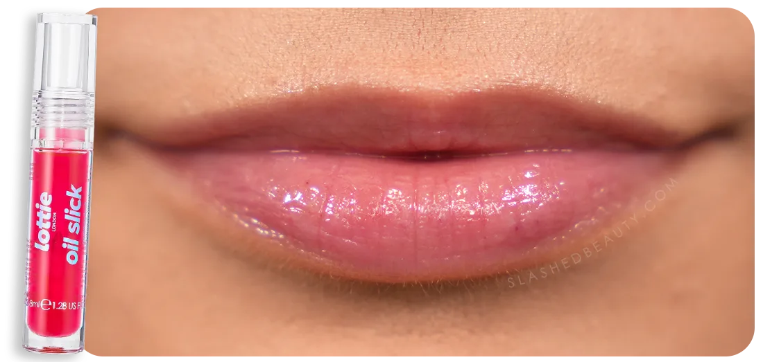 Close up lip swatch of Lottie London Oil Slick Lip Oil in Strawberry Dreams | The 5 Best Drugstore Lip Oils Tested & Compared | Slashed Beauty