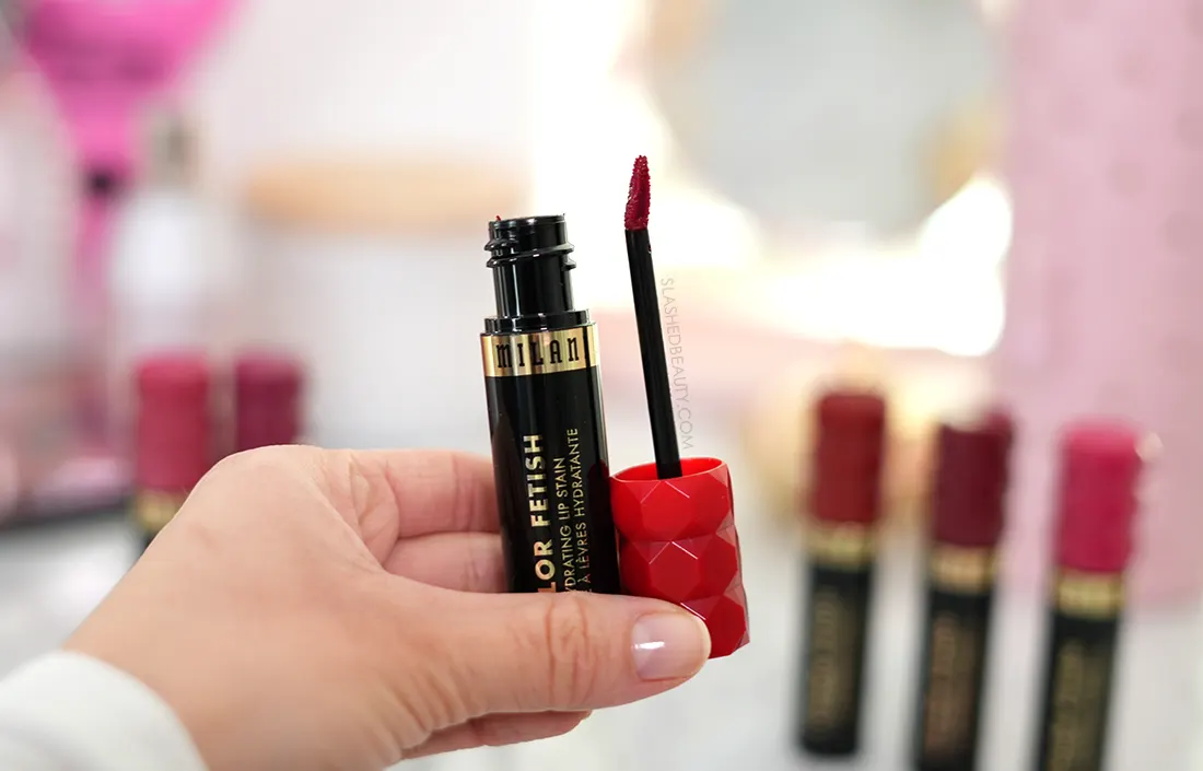 Hand holding open tube of Milani Color Fetish Hydrating Lip Stain | Review & Swatches | Slashed Beauty