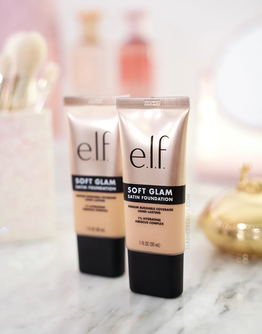 Two tubes of e.l.f. Soft Glam Satin Foundation standing side by side on a vanity | e.l.f. Soft Glam Satin Foundation Review | Slashed Beauty