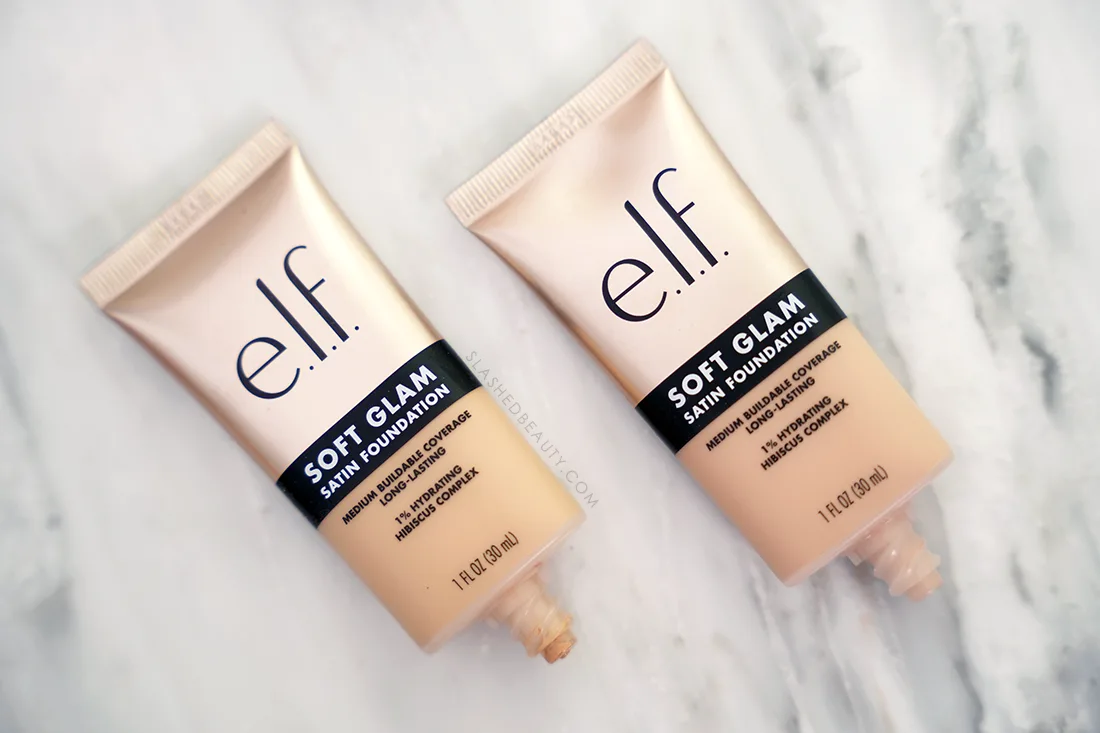 Two tubes of e.l.f. Soft Glam Satin Foundation lying flat on a marble surface | e.l.f. Soft Glam Satin Foundation Review | Slashed Beauty