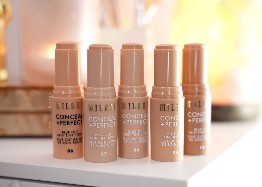 Five tubes of Milani Ultra Blur Skin Tint Stick standing on a vanity. | Review | Slashed Beauty